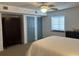 Bright bedroom featuring a queen bed, ceiling fan, closet, and dresser at 2151 Bridgeview Ct. # 3-305, North Myrtle Beach, SC 29582