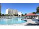 Expansive community pool with ample lounging areas and tropical palms at 2151 Bridgeview Ct. # 3-305, North Myrtle Beach, SC 29582