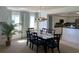 Bright dining room features seating for six, stylish modern light fixture, and access to the kitchen at 2151 Bridgeview Ct. # 3-305, North Myrtle Beach, SC 29582
