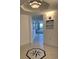 View of a hallway with decorative floor tile leading to a room with a scenic view and patio access at 2151 Bridgeview Ct. # 3-305, North Myrtle Beach, SC 29582