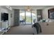 Living room with comfortable seating and curtains, and a sliding glass door to the balcony, Grande Dunes at 2151 Bridgeview Ct. # 3-305, North Myrtle Beach, SC 29582