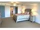 Spacious main bedroom with en-suite bathroom, ceiling fan, and ample room for furnishings at 2151 Bridgeview Ct. # 3-305, North Myrtle Beach, SC 29582