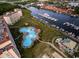 Aerial view of a uniquely shaped pool, marina, boat docks, and waterway in Grande Dunes, Myrtle Beach, SC at 2151 Bridgeview Ct. # 3-305, North Myrtle Beach, SC 29582