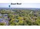 Scenic aerial view of a community near Sunset Beach, featuring lush greenery and nearby amenities at 220 Clubhouse Dr. # 20B, Sunset Beach, NC 28468