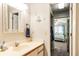 Bathroom features a vanity with a mirror and decorative nautical themed wall hangings at 220 Clubhouse Dr. # 20B, Sunset Beach, NC 28468