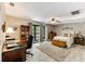 Large bedroom features a desk and sliding glass doors to screened porch at 220 Clubhouse Dr. # 20B, Sunset Beach, NC 28468