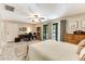 Large bedroom features a desk and sliding glass doors to screened porch at 220 Clubhouse Dr. # 20B, Sunset Beach, NC 28468