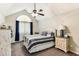 Bright bedroom with vaulted ceiling, classic furniture, and plenty of natural light, exuding comfort at 220 Clubhouse Dr. # 20B, Sunset Beach, NC 28468