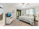 This bedroom features a queen bed, ceiling fan, and sliding door to the screened porch at 220 Clubhouse Dr. # 20B, Sunset Beach, NC 28468