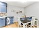 Cozy dining area with a dark wood table, white chairs, and stylish décor at 220 Clubhouse Dr. # 20B, Sunset Beach, NC 28468