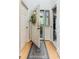 Bright entryway with an open door that has decorative wreath and leads to a glimpse of the outdoor porch at 220 Clubhouse Dr. # 20B, Sunset Beach, NC 28468