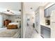 Hallway view with vinyl flooring, bathroom, kitchenette, and bedroom at 220 Clubhouse Dr. # 20B, Sunset Beach, NC 28468