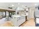 Modern kitchen with stainless steel appliances, double sink, and an open layout to the living room at 220 Clubhouse Dr. # 20B, Sunset Beach, NC 28468
