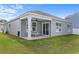 Back porch area featuring covered seating and a fan at 234 Belmonte Dr., Myrtle Beach, SC 29588