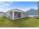 Backyard featuring a covered seating area and open yard space at 234 Belmonte Dr., Myrtle Beach, SC 29588