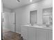 Bathroom featuring a double sink vanity with white cabinets, modern fixtures, and luxury flooring at 234 Belmonte Dr., Myrtle Beach, SC 29588