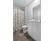 Bright bathroom showcasing a floral shower curtain and a modern sink and vanity at 234 Belmonte Dr., Myrtle Beach, SC 29588