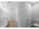 Bright bathroom featuring a modern toilet, wood floors, and a glass-enclosed shower at 234 Belmonte Dr., Myrtle Beach, SC 29588
