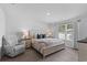 Bright bedroom showcasing a queen bed, neutral decor, and ample natural light at 234 Belmonte Dr., Myrtle Beach, SC 29588