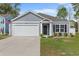 Charming one-story home with an attached garage, gray siding, and well-maintained landscaping at 234 Belmonte Dr., Myrtle Beach, SC 29588