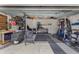 Spacious garage with ample storage, workbench, and fitness area at 234 Belmonte Dr., Myrtle Beach, SC 29588