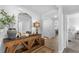 Neutral hallway with wooden console table, mirror, and light-toned wood flooring at 234 Belmonte Dr., Myrtle Beach, SC 29588