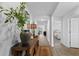 Inviting hallway with wood floors, neutral walls, and stylish decor at 234 Belmonte Dr., Myrtle Beach, SC 29588