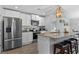 Bright kitchen featuring stainless appliances, granite counters, and white cabinetry at 234 Belmonte Dr., Myrtle Beach, SC 29588