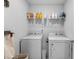 Bright laundry room with shelving and modern Whirlpool washer and dryer at 234 Belmonte Dr., Myrtle Beach, SC 29588