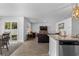 Open concept living space showing the kitchen, dining area, and living room with a leather sofa at 234 Belmonte Dr., Myrtle Beach, SC 29588
