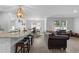 Open floor plan showcasing the kitchen, dining, and living area with modern decor at 234 Belmonte Dr., Myrtle Beach, SC 29588