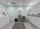 Well-lit laundry room with multiple machines for residents' convenience at 2401 S Ocean Blvd. S # 1256, Myrtle Beach, SC 29577