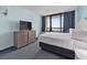 Relaxing bedroom featuring a comfortable bed, ample natural light, and a dresser at 2401 S Ocean Blvd. S # 1256, Myrtle Beach, SC 29577