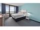Stylish bedroom featuring a plush bed and sliding glass doors to balcony with great views at 2401 S Ocean Blvd. S # 1256, Myrtle Beach, SC 29577