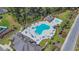 Aerial view of community pool with ample seating, showcasing a perfect amenity for relaxation and recreation at 254 Tall Palms Way, Little River, SC 29566