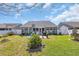 Well-maintained backyard with lush green grass, white fence, and patio area perfect for entertaining at 254 Tall Palms Way, Little River, SC 29566