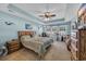 Tranquil bedroom featuring a tray ceiling, ceiling fan, lots of light and stylish decor at 254 Tall Palms Way, Little River, SC 29566