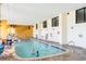 Bright indoor pool offering year-round enjoyment with large windows and comfortable lounging area at 2600 N Ocean Blvd. # 1401, Myrtle Beach, SC 29577