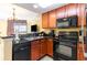Well-equipped kitchen featuring modern appliances and granite countertops adjacent to the living area at 2600 N Ocean Blvd. # 1401, Myrtle Beach, SC 29577