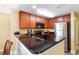 Modern kitchen with stainless steel appliances and granite countertops, offering a sleek and efficient space at 2600 N Ocean Blvd. # 1401, Myrtle Beach, SC 29577