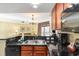 Open kitchen showcases stainless steel appliances, dark countertops, and a view into the living space at 2600 N Ocean Blvd. # 1401, Myrtle Beach, SC 29577