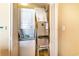 Compact laundry closet with a stacked washer/dryer and storage space at 2600 N Ocean Blvd. # 1401, Myrtle Beach, SC 29577