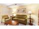 Cozy living room features a sofa, armchair, lamps, and a wooden coffee table at 2600 N Ocean Blvd. # 1401, Myrtle Beach, SC 29577