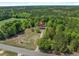A bird's eye view of a house in a serene location with lush, green surroundings at 2865 N Nichols Hwy., Nichols, SC 29581