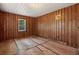 Bedroom featuring wood paneling, white ceiling, and a bright window at 2865 N Nichols Hwy., Nichols, SC 29581