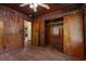 Bedroom featuring hardwood floors, wood paneling, and closet with an open doorway at 2865 N Nichols Hwy., Nichols, SC 29581