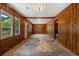 Living room featuring wood paneling and multiple windows, providing ample natural light at 2865 N Nichols Hwy., Nichols, SC 29581