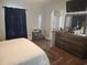 Cozy bedroom features wood flooring and a large dresser; the television is wall-mounted at 328 Harbour Reef Dr., Myrtle Beach, SC 29588