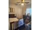 Cozy bedroom with a wood bed frame, ceiling fan, and charming decor at 328 Harbour Reef Dr., Myrtle Beach, SC 29588