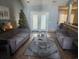 Spacious living room filled with comfortable furniture and a Christmas tree, creating a relaxing atmosphere at 328 Harbour Reef Dr., Myrtle Beach, SC 29588
